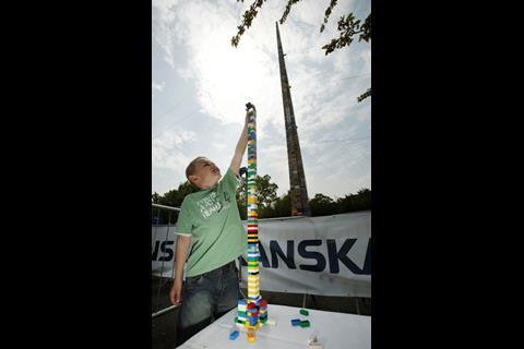 Visitor to Legoland Windsor helps build the tower